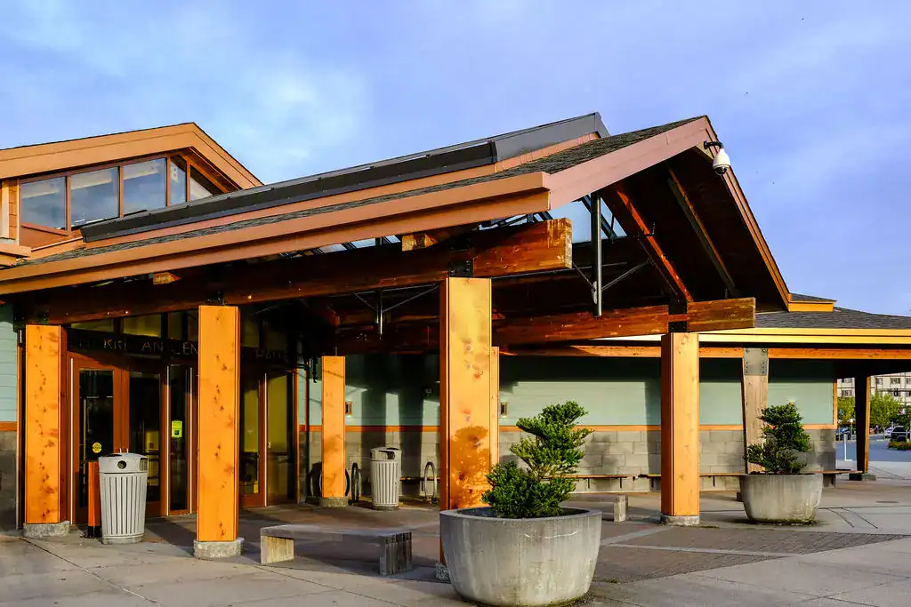 The front entrance to a building with a large wooden structure.