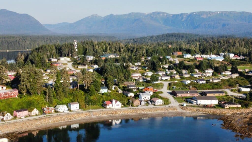 A village is surrounded by mountains.